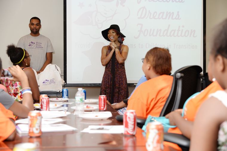 There wasn’t a dry eye in the room, as Brandy shared her very personal struggles and stressed the importance of staying and thinking positive while giving back with the help of the Precious Dreams Foundation.