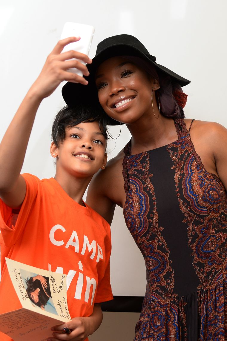 Brandy has a heart of gold. Here she is taking a selfie with one of the kids from the Precious Dreams Foundation. The Broadway star provided comfort items and motivational words to NYC Homeless Youth this week. What a way to give back.