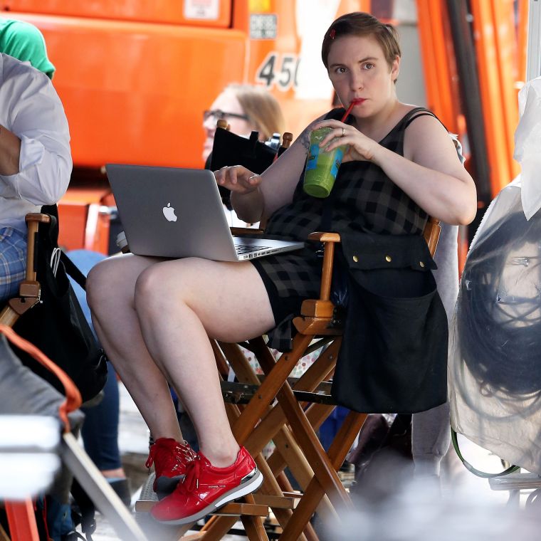 Lena Dunham, this picture should be a poster for zero phucks given. She's just drinking green juice and writing million dollar scenes on her MacBook in Soho while filming "Girls."