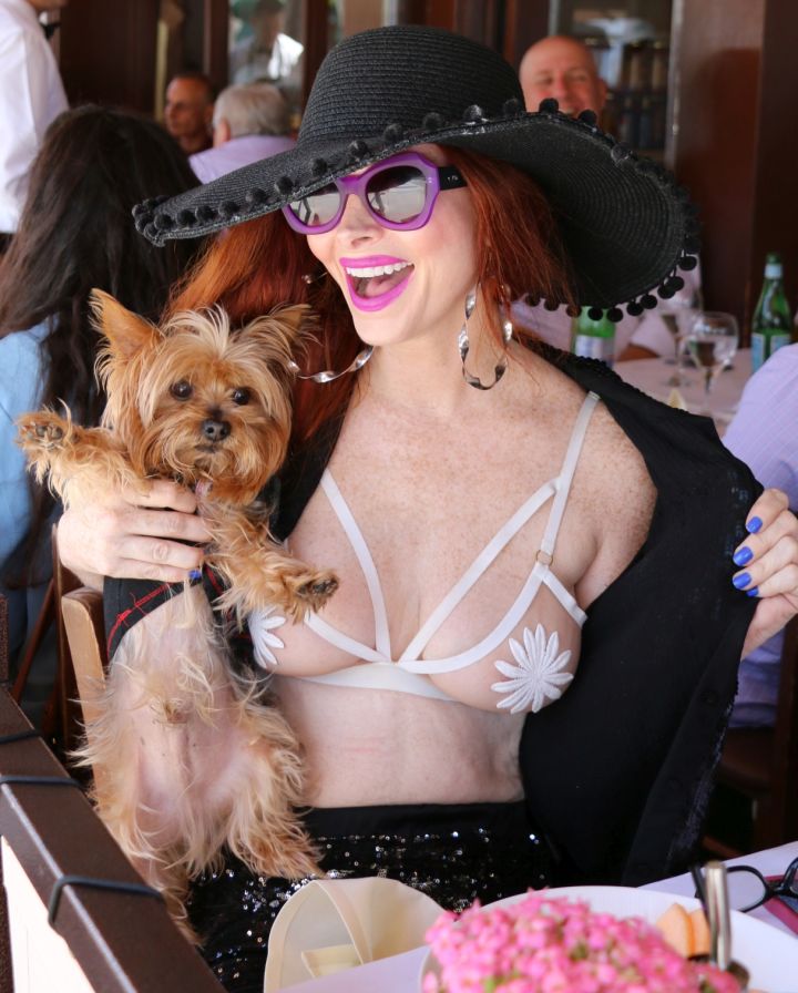 Phoebe Price has really nice…earrings. Her dog’s name is Henry and they are in Beverly Hills, because we know you really like looking at the dog.