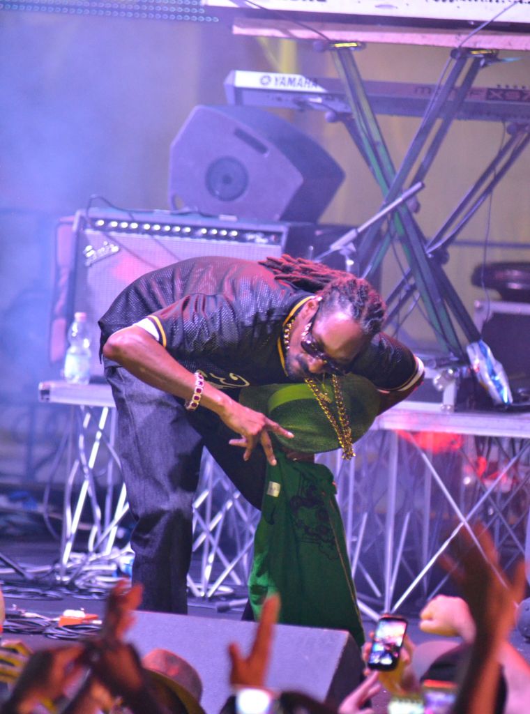 Uncle Snoop hit that get down low pose while performing in Naples at Arenile Beach.