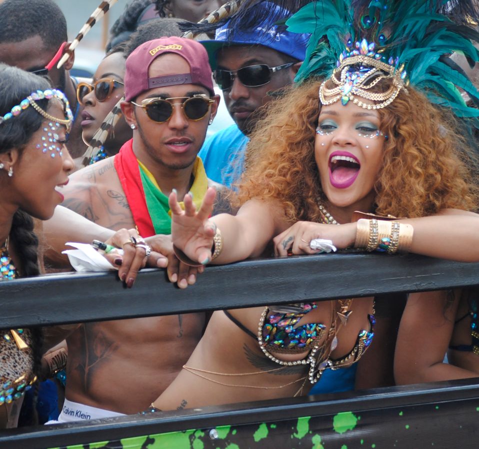 Rihanna and Lewis Hamilton are pictured partying during Barbados' Kadooment Day Parade