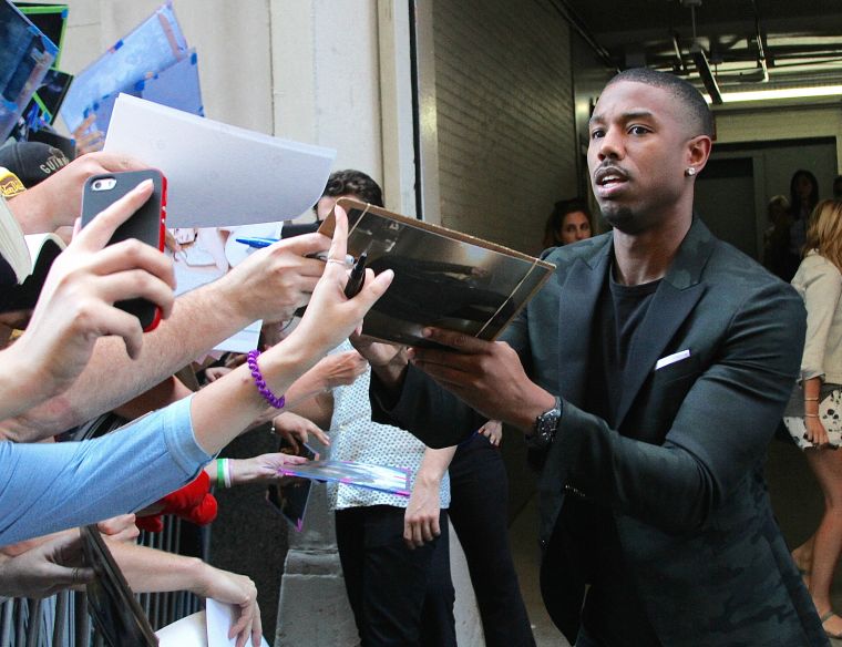 Michael B. Jordan was spotted signing autographs for fans outside of “HuffPost Live” in NYC.