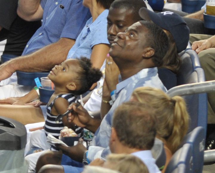 Tracy Morgan attends the Yankees/Red Sox game at Yankee Stadium with his daughter.