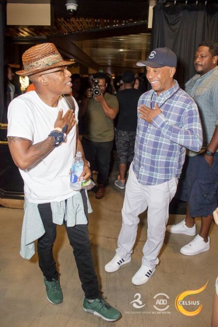 Russell Simmons and Raphael Saadiq share a laugh.