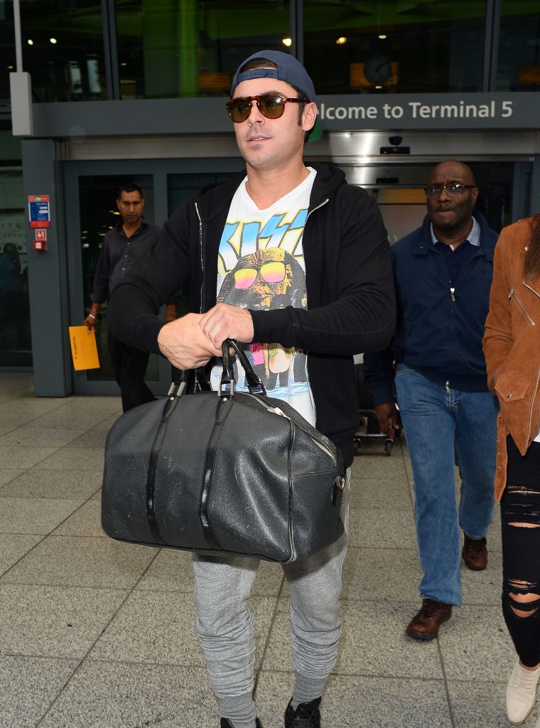 Zac Efron kept it casual while arriving at Heathrow Airport in London.