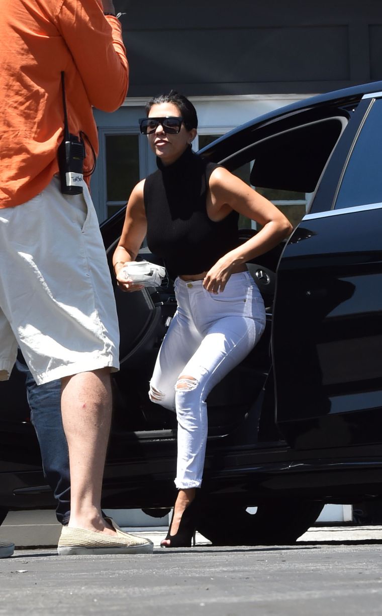 Flaunting toned abs.