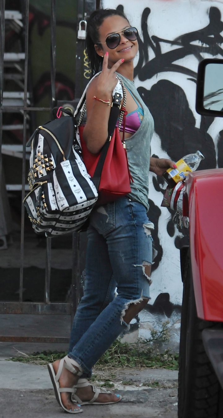 Christina Milian was seen heading into her new store on Melrose – she hasn’t aged a day since we met her at 19.