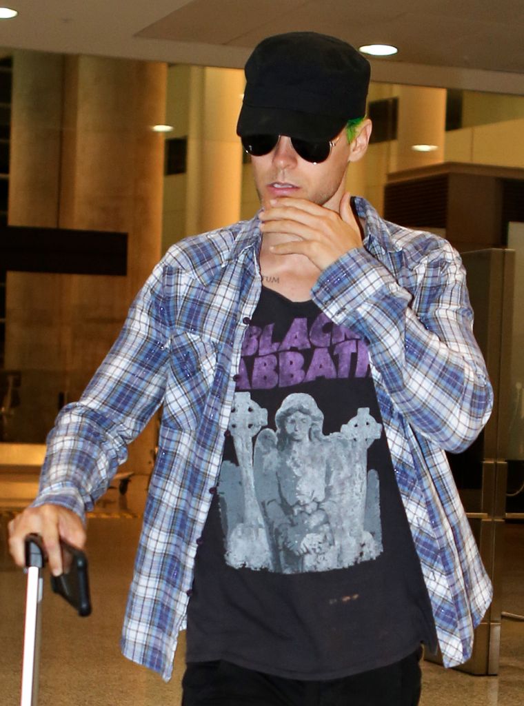 Jared Leto showed off his green hair while leaving the airport in Los Angeles.