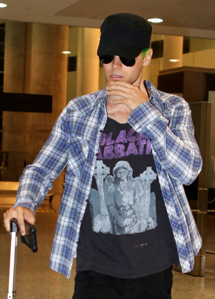 Jared Leto showed off his green hair while leaving the airport in Los Angeles.