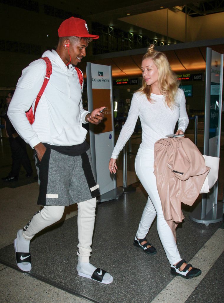 Nick Young and Iggy Azalea got lovey-dovey at LAX airport.