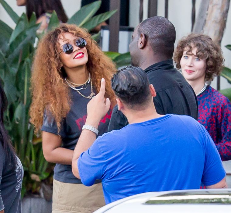 Rihanna was all smiles while taking selfies with fans.