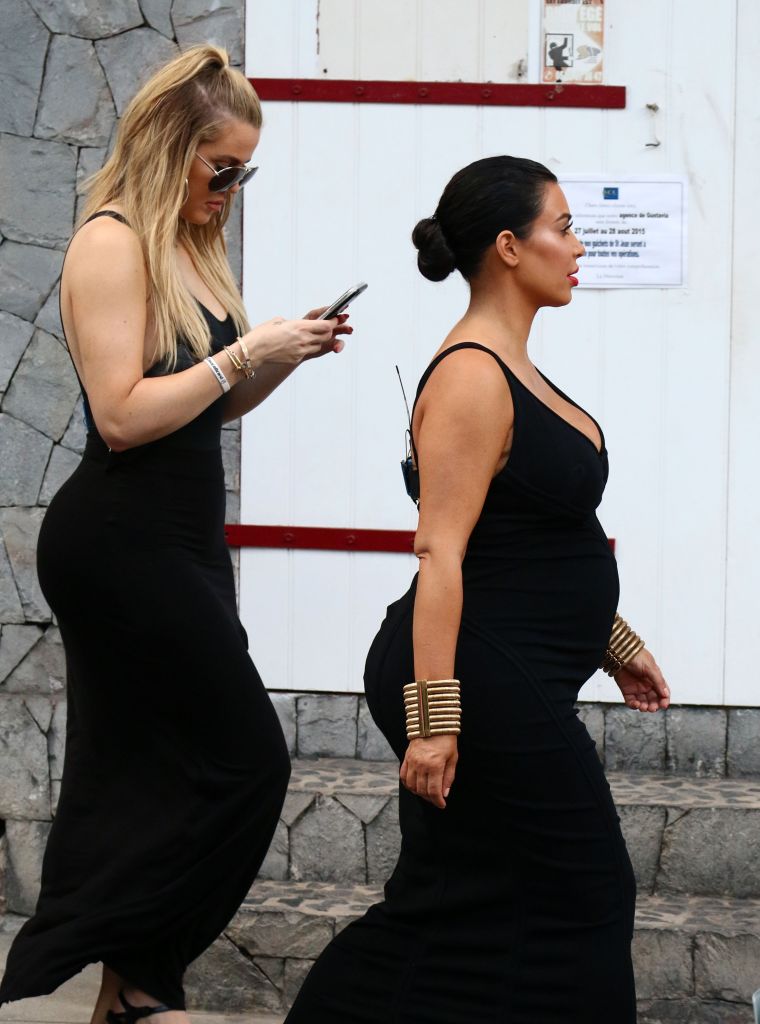 Preggo Kim and Khloe Kardashian walk around St. Barts while on vacation with the family.