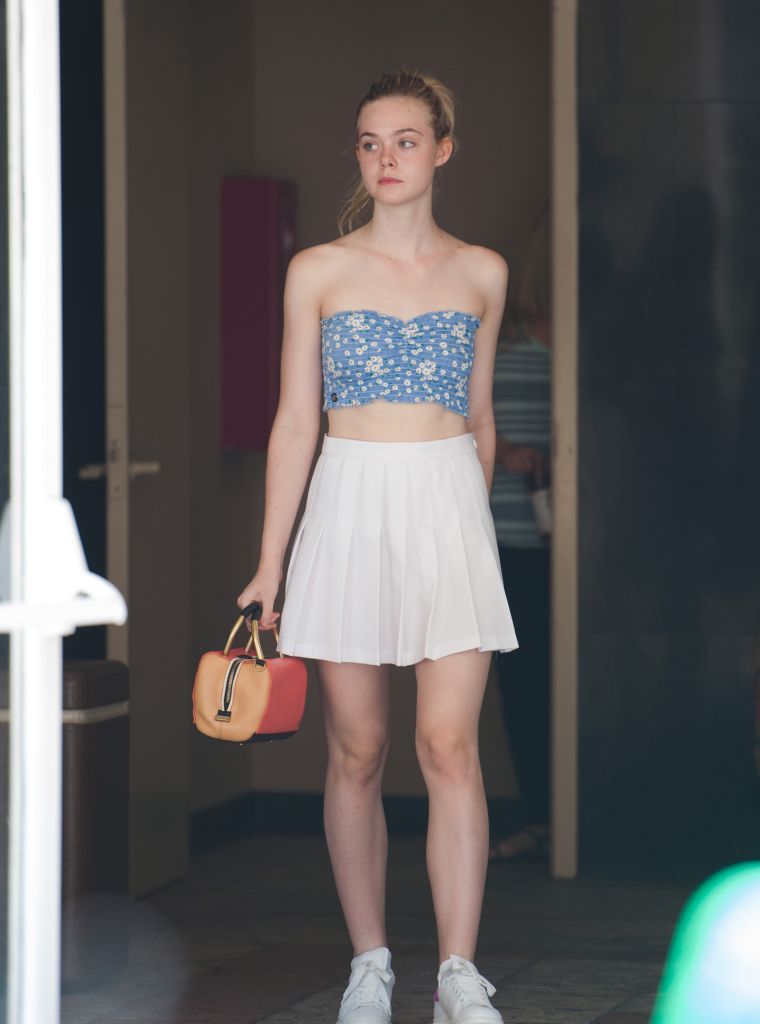 Elle Fanning, 17, does some shopping in Los Angeles, California with her mother is off doing her own thing.