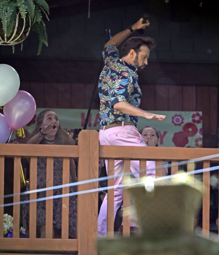 Jason Sudeikis filmed a scene where he raps for everyone at a Mother’s Day party, then accidentally falls off the porch balcony on set of the film “Mother’s Day” in Atlanta, GA.