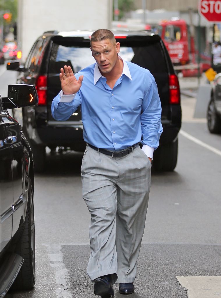 John Cena wears one comfortable suit as he walks into his hotel in New York before Summer Slam.
