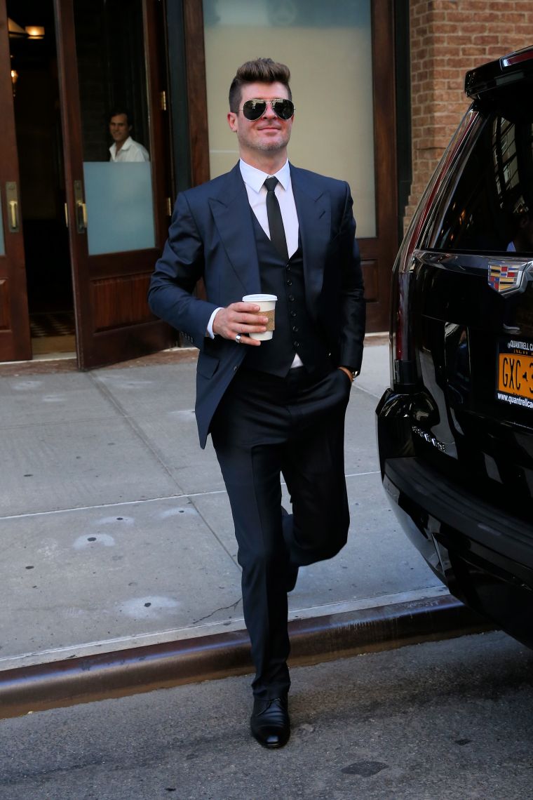 Robin Thicke looked happy as a clam as he left the Greenwich Hotel in NYC.