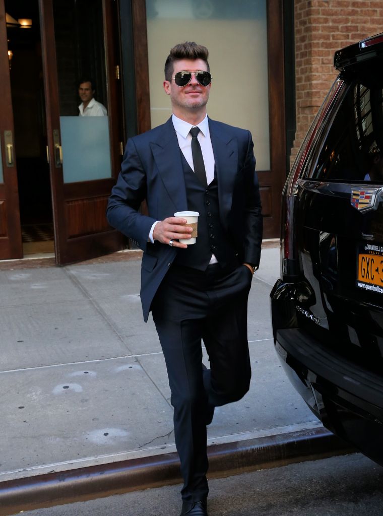 Robin Thicke looked happy as a clam as he left the Greenwich Hotel in NYC.