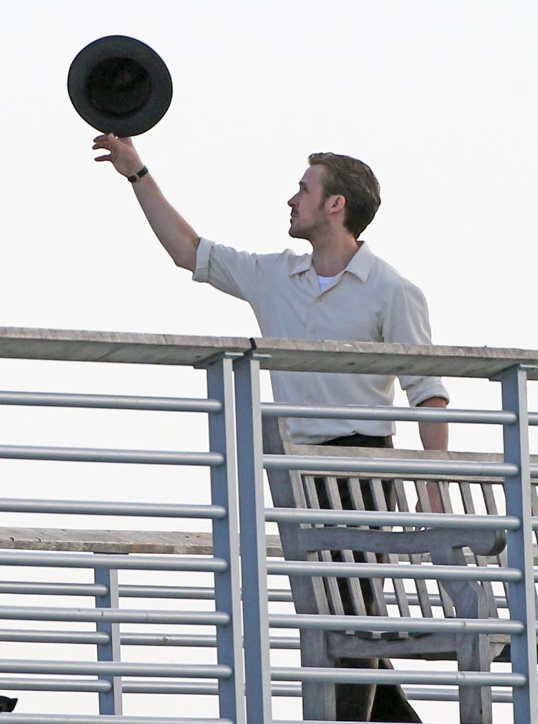 Ryan Gosling pulls off a sick hat trick as he filmed a scene on a Los Angeles pier for his latest movie, "La La Land."