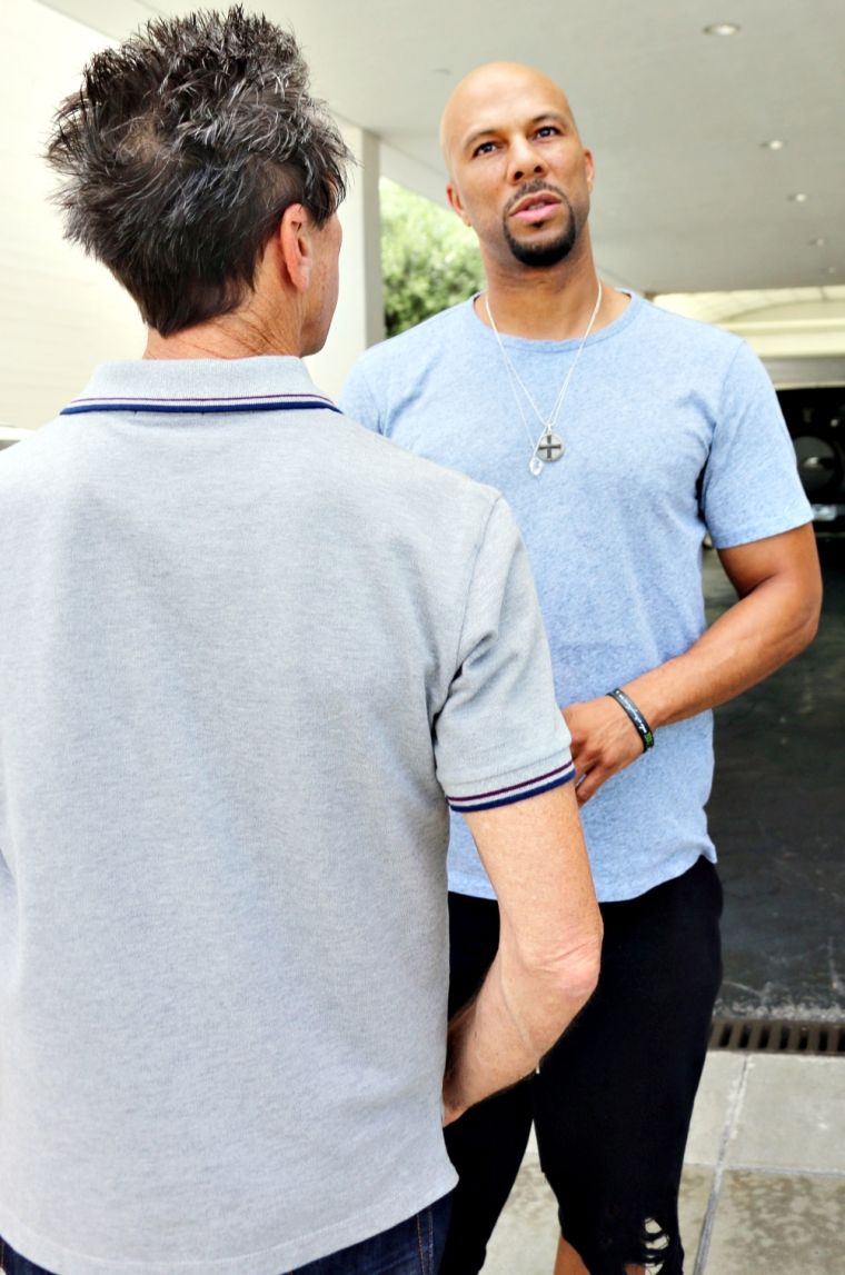 Common is working on a major deal. Here he is chatting it up with movie producer Brian Grazer at lunch.