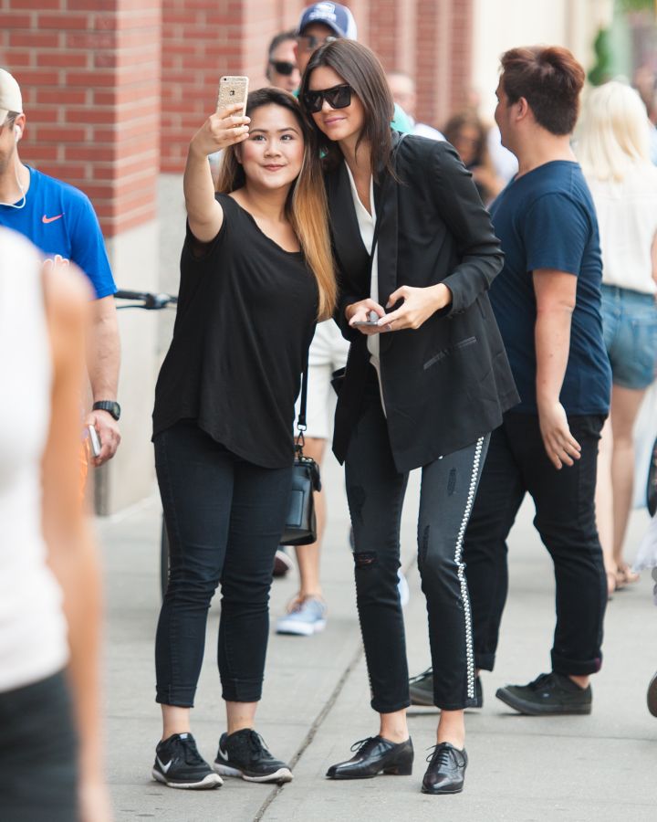 Kendall Jenner takes a selfie with a fan in New York City.