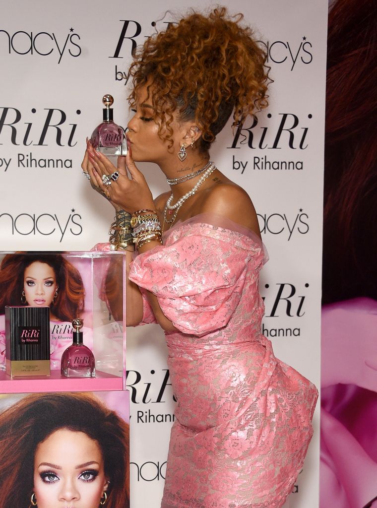 Rihanna kisses her latest scent, RiRi by Rihanna, during the unveiling at Macy's Downtown Brooklyn in NYC.