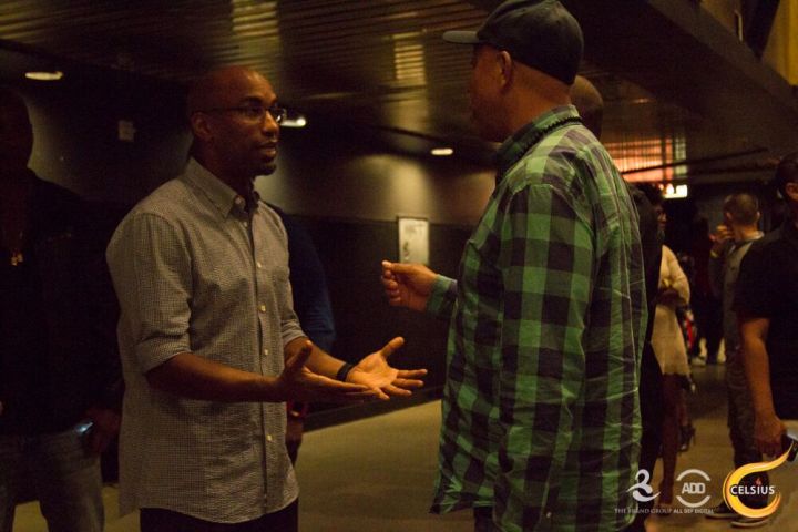 Russell Simmons chats it up with Tim Story.