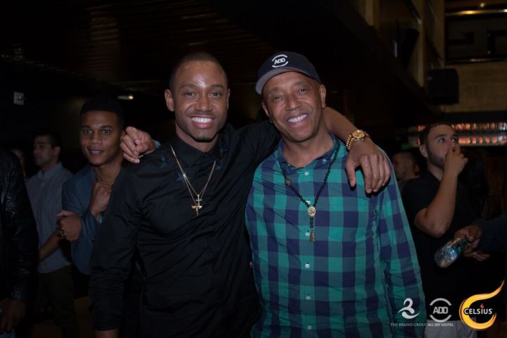 Russell Simmons & Terrence J pose for a picture.