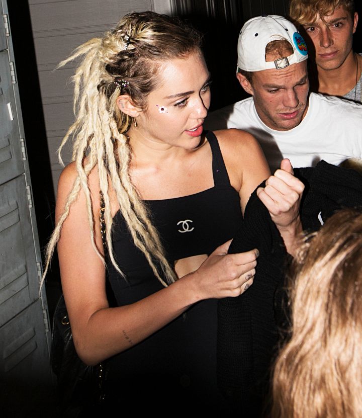 Miley Cyrus greets fans as she leaves The Nice Guy bar in West Hollywood.