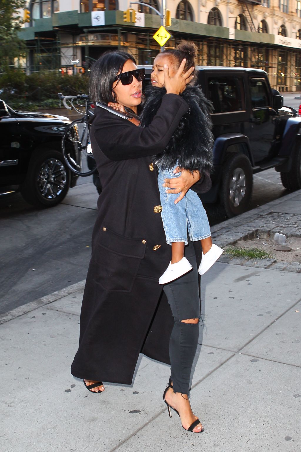 Kim Kardashian arrives in NYC at Kanye West's apartment with baby North