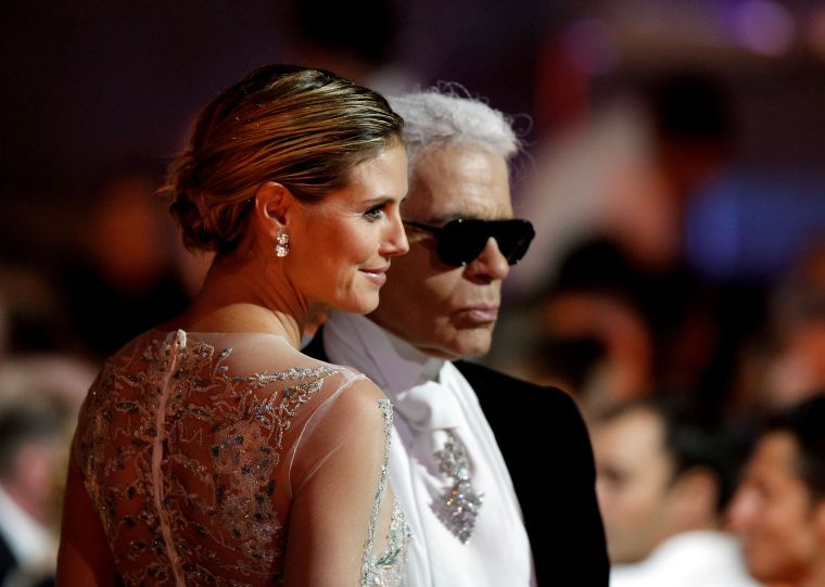 Karl and Heidi Klum show face.