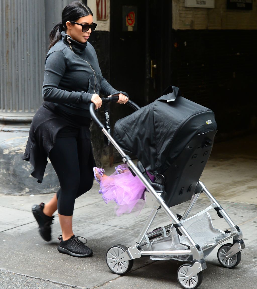 Kim Kardashian walks north west in a purple princess dress
