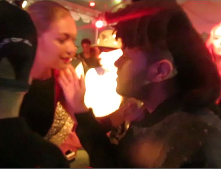 Gigi Hadid and The Weeknd greeted with a kiss on the cheek while arriving at RiRi’s top secret NYC block party.