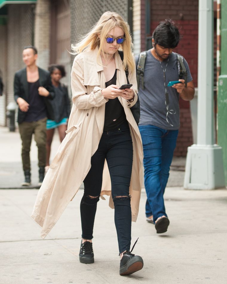 Dakota Fanning was all into her phone as she headed to the gym in NYC.