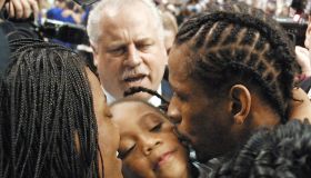 Philadelphia 76ers' Allen Iverson (R) kisses his d