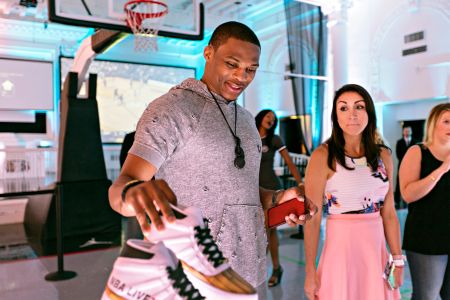 Russell Westbrook checking out the new EA Sports sneaks.