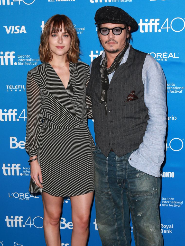 Dakota Johnson and Johnny Depp posed for a picture together at the premiere of their film “Black Mass” at TIFF.
