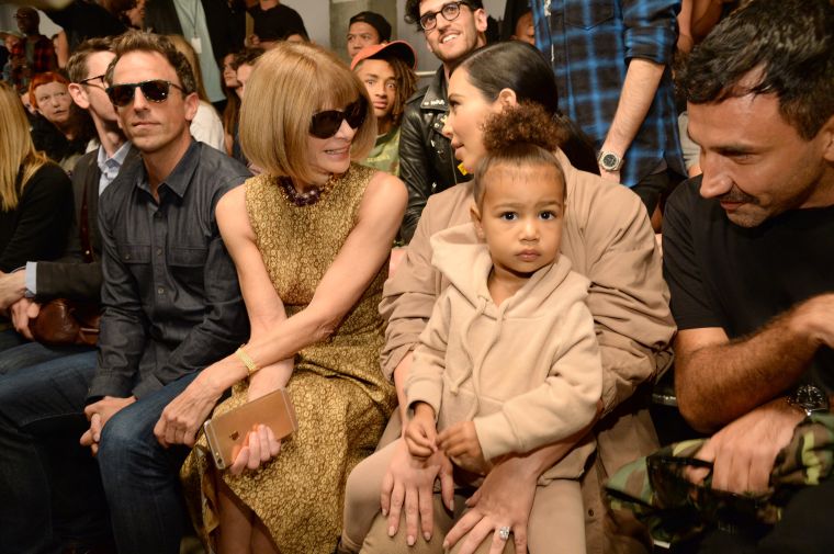 Anna Wintour talks to Kim Kardashian as North West keeps her focus.