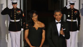 President Barack Obama and Michelle Obama waiting on the North Portico for the arrival of Chinese President Xi Jinping and his wife Madame Peng Liyuan ahead of a state dinner at the White House September 25, 2015 in Washington, DC.