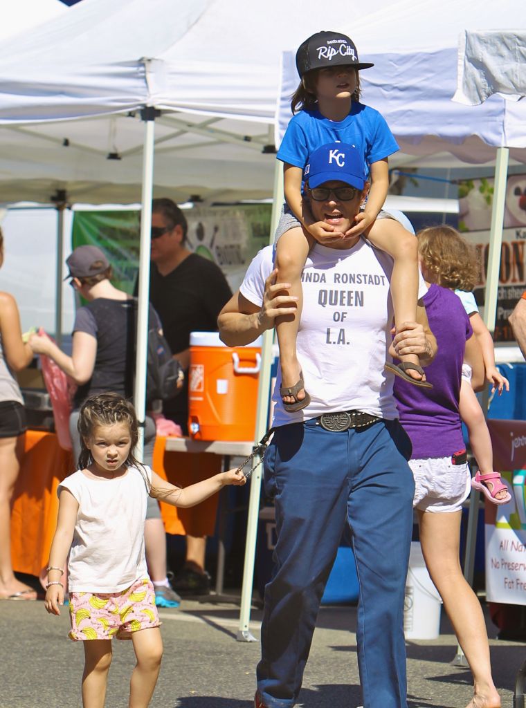 Johnny Knoxville gave his son Rocko a ride on his shoulders, while his daughter Arlo held onto his wallet chain through the busy Studio City Farmers Market.