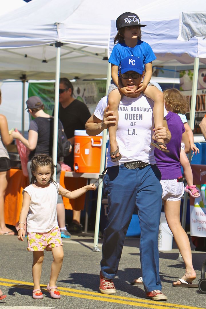 Johnny Knoxville gave his son Rocko a ride on his shoulders, while his daughter Arlo held onto his wallet chain through the busy Studio City Farmers Market.