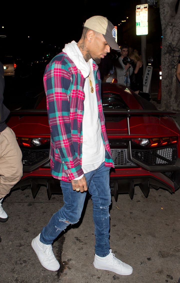 Chris Brown was seen arriving to Warwick nightclub in his new burgundy-colored Lamborghini Aventador sports car in Hollywood, CA.