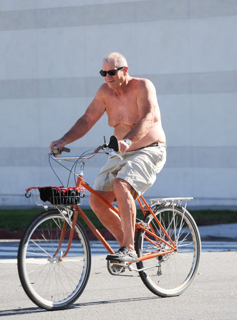 This is Ed O'Neill to some people, but to others it's a picture of Al Bundy riding a bike shirtless.