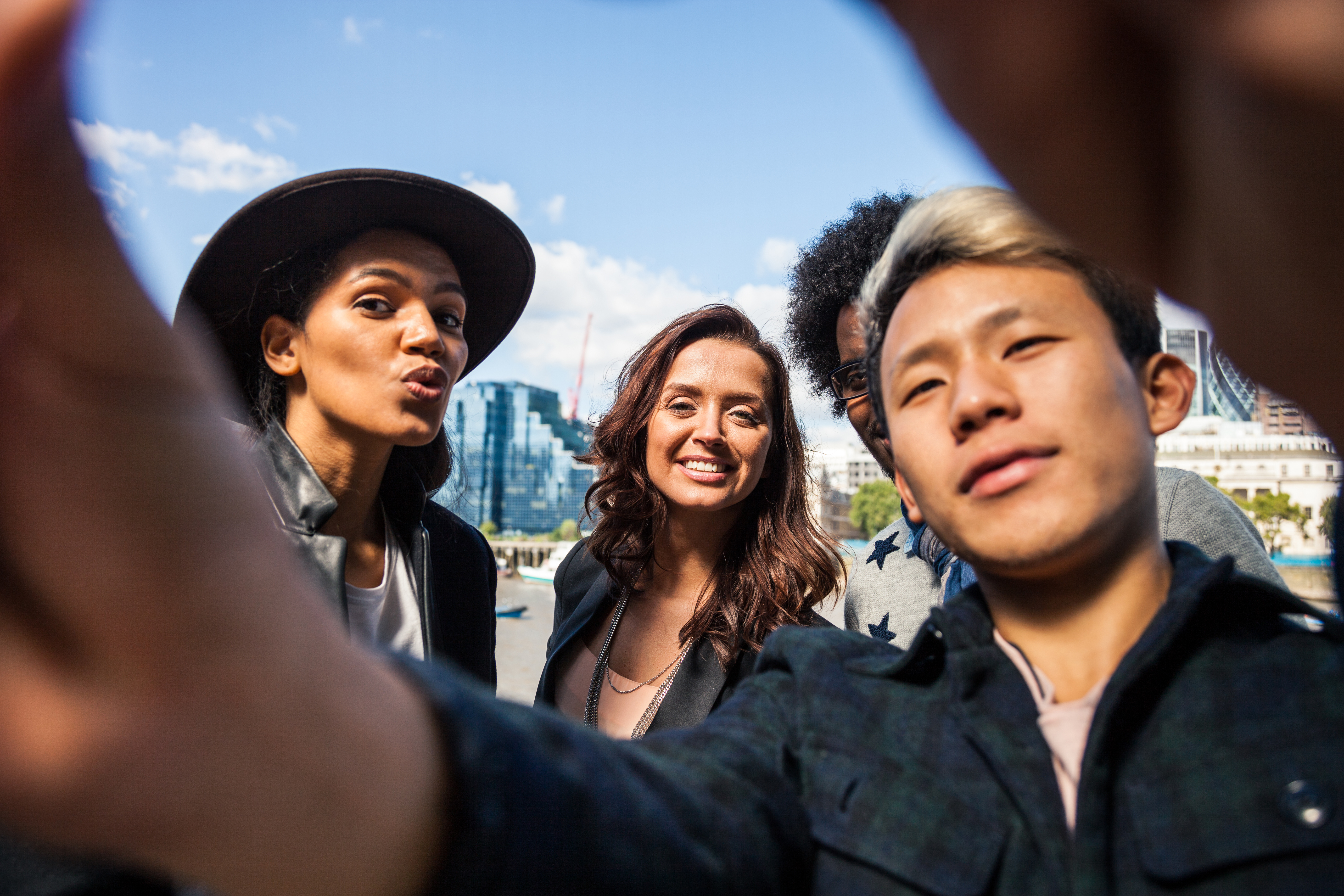 Multi cultural group of friends taking a selfie in London
