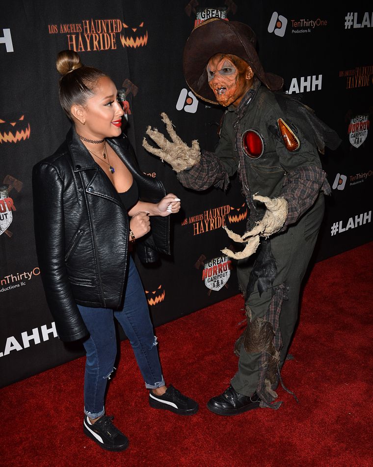 Adrienne Bailon wasn't about that horror life at the grand opening of the Haunted Hay Ride.