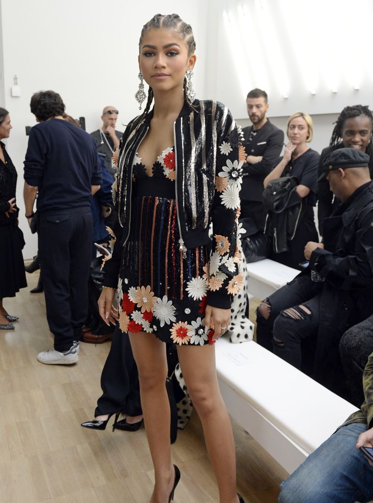 Cornrows and designer clothes.