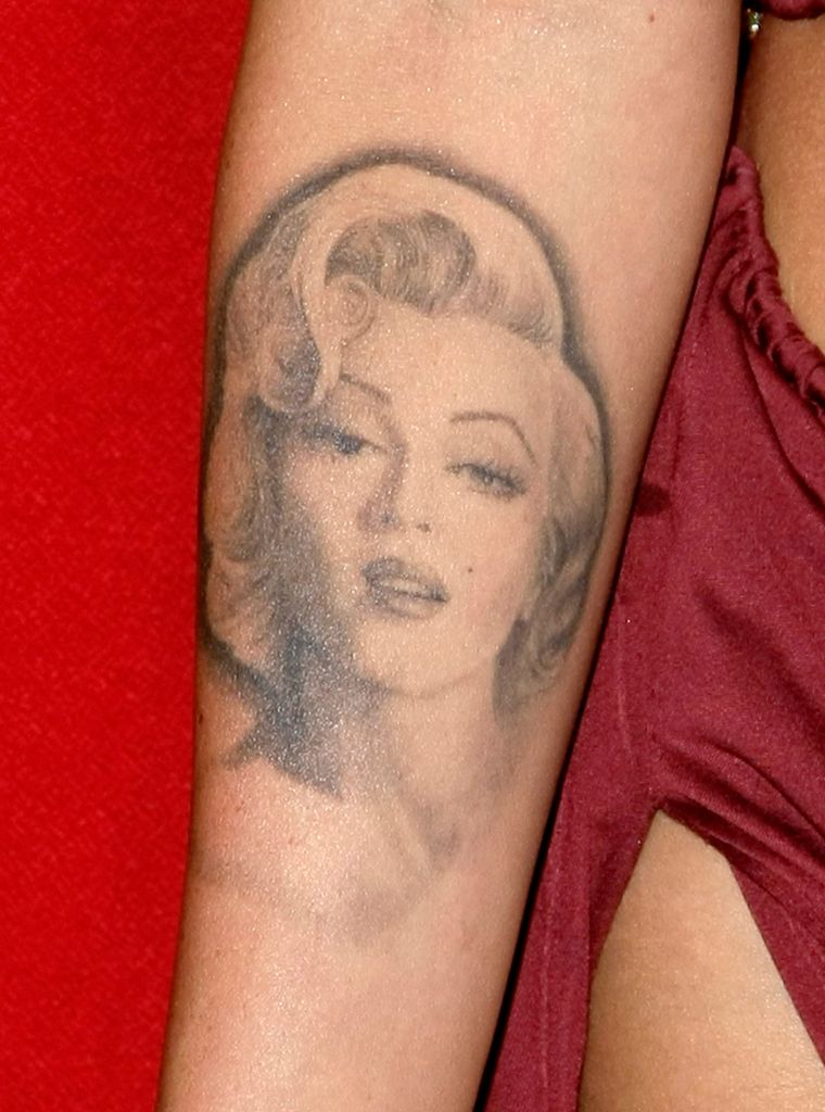 Megan has started laser surgery to remove her infamous Marilyn Monroe tattoo.