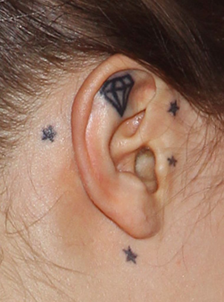 Cara Delevingne doesn't do diamond earrings. She has a permanent diamond in her ear.