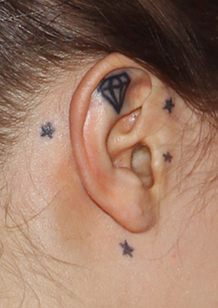 Cara Delevingne doesn’t do diamond earrings. She has a permanent diamond in her ear.