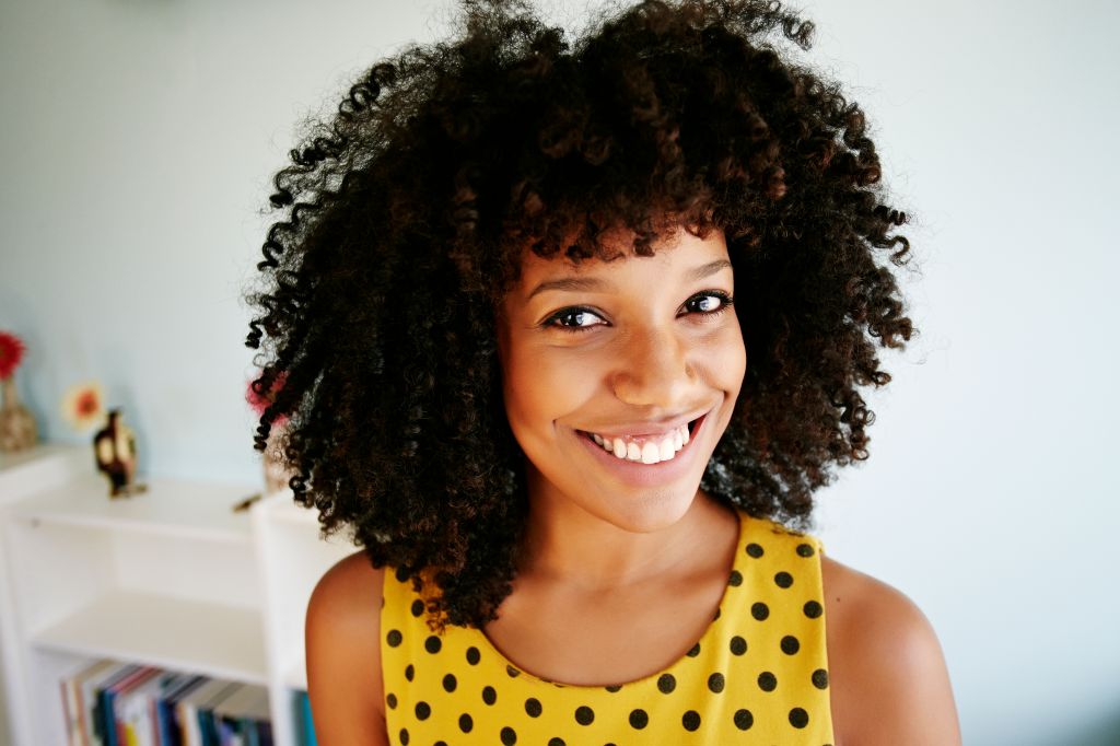 Close up of smiling face of mixed race woman